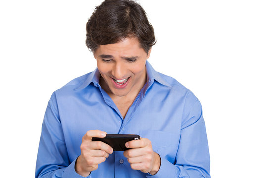 Happy man sees something exciting on phone, smiling