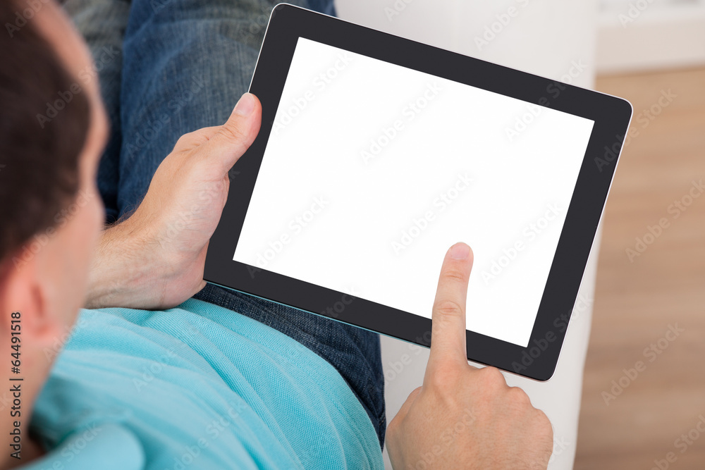 Poster man looking at blank screen of digital tablet