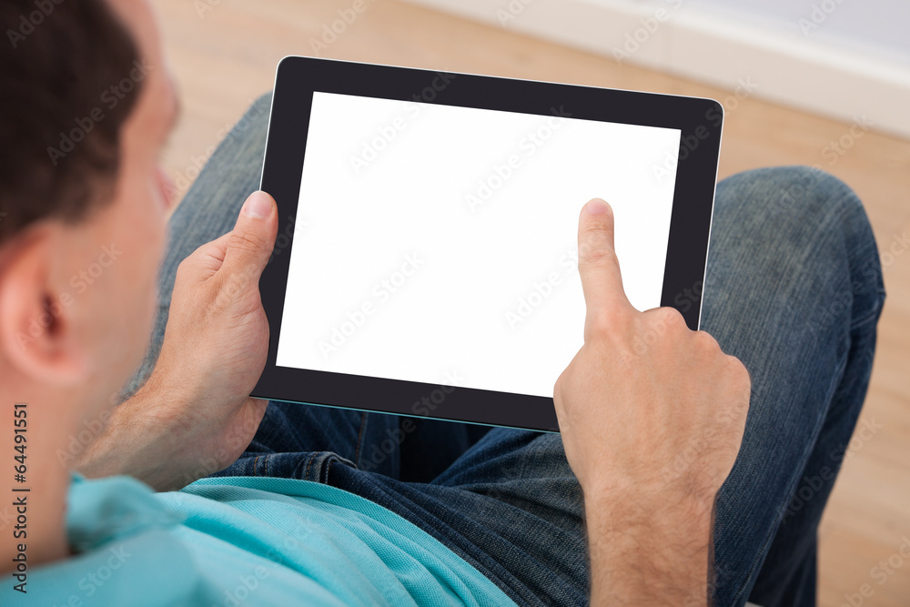 Poster man looking at blank screen of digital tablet