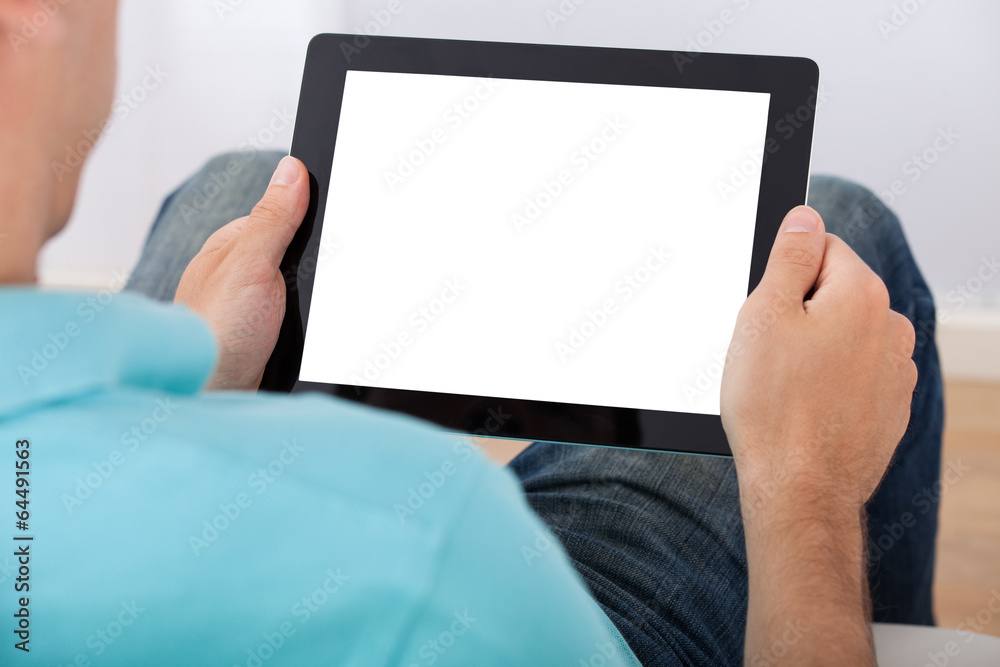 Poster man looking at blank screen of digital tablet