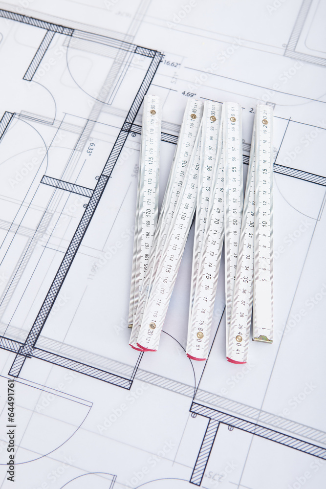 Poster folding ruler on blueprint