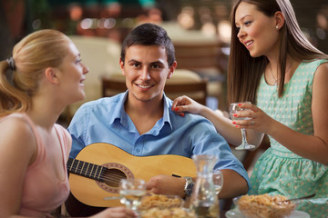 Small group of friends enjoying dinner