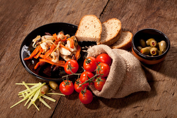 Dish with meat, tomato, cheese and olives