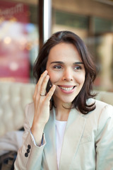 Closeup of a mid adult woman on the phone.