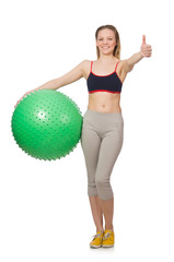 Woman exercising with swiss ball on white