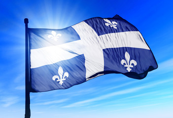 Quebec (Canada) flag waving on the wind - obrazy, fototapety, plakaty