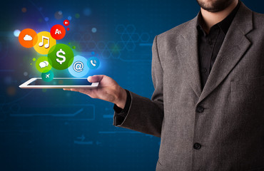 Businessman presenting colorful modern signs