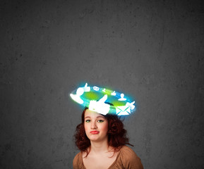 Young teenager with cloud social icons around her head