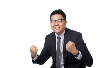 Asian businessman hold his fists happy with success