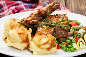 Pork spareribs served with mashed potatoes