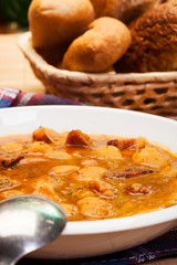Beans with tomato sauce, bacon and sausage