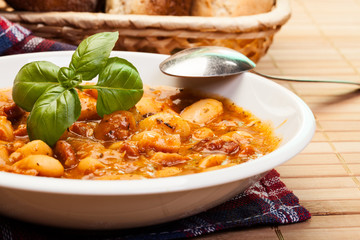 Beans with tomato sauce, bacon and sausage