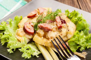 Scalloped potatoes with sausage and bacon
