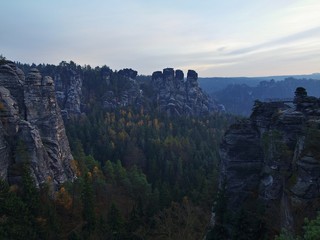 andstone peaks and hills increased from colorful background. 