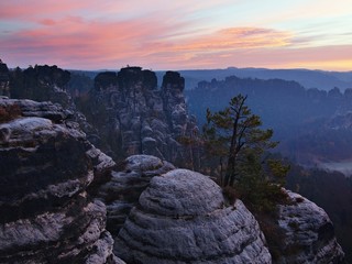 Autumn early morning view over rock empires to fall valley 