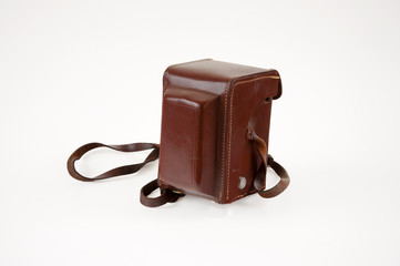 Old vintage camera in a brown leather case