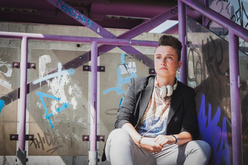 Pretty short hair girl sitting on the stairs