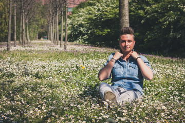 Short hair girl sitting in the grass