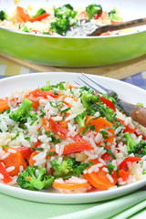 Rice with broccoli, onions, carrots and paprika
