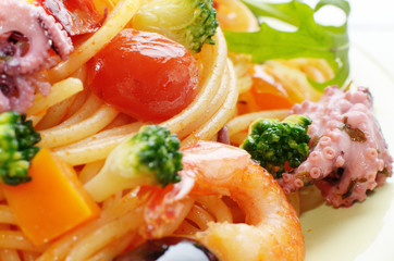 Seafood spaghetti pasta dish with octopus shrimps