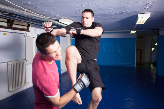 knee kick during mma training