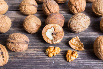 Walnuts on old wooden background