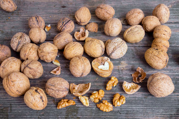 Walnuts on old wooden background