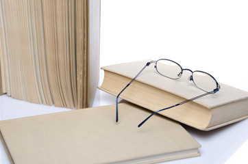 Composition of books with glasses