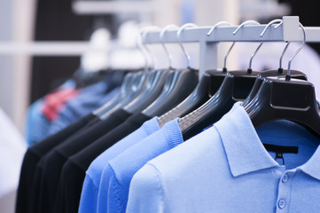 clothing on hangers at the boutique.