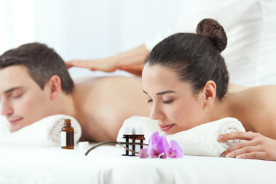 Young couple having aromatherapy massage in a spa.