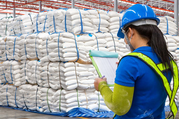 stacked sacks of meal in warehouse waiting for transportation