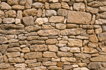 antique wall built with roman times stones