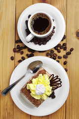 Cup of hot coffee and cake