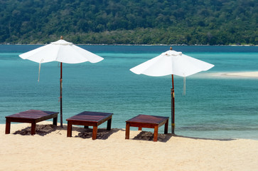 Beds and umbrella on a tropical beach