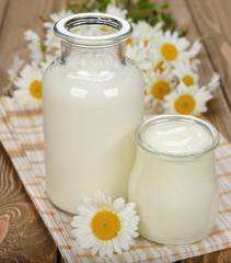 Obraz na płótnie Canvas Milk, yogurt and chamomile