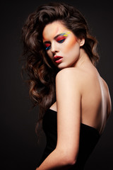 Fototapeta premium Close up portrait of a beautiful fashion model with curly hair