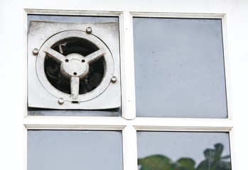 Exhaust fan in the kitchen is embedded in the glass wall