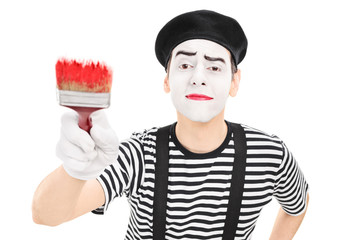 Mime artist holding a paintbrush