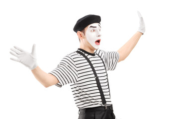 Surpised mime artist gesturing with hands