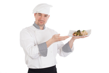 Chef showing and holding a plate of prepared food