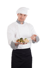 Chef showing and holding a plate of prepared food