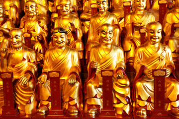 Fototapeta premium Gold statues of the Lohans