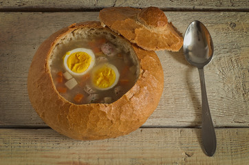 Easter soup with egg and sausage in bread