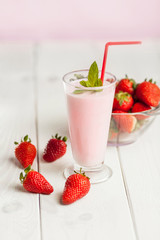 Strawberry milk shake in pastel colored .