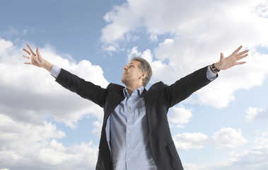 businessman under blue sky