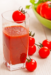 tomato juice and fresh organic cherry tomato