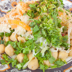 Salad with chickpeas, cabbage, carrots, greens