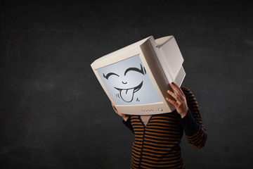 Young girl wearing a monitor with a funny face