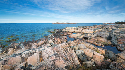 Fototapeta na wymiar Rocky coast with colorful rocks