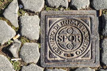 Roman Drain Cover with sign and abbreviation SPQR